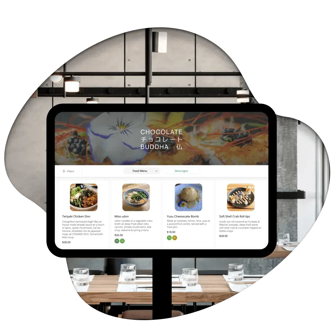 A self-order kiosk tablet mounted in a restaurant showing a digital food and beverage menu